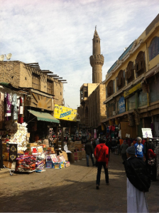 One can see a minaret and a mosque whose roof is damaged and disappears between the neighboring buildings. The contrast is obvious between the more “glamorous” parts of Al-Mu’izz street and its second half, which is cut by Al-Azhar street. All of this area is protected area under World Heritage Site regulations. Photo: LP